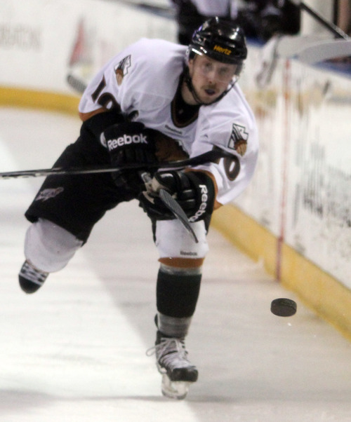 Rick Egan  | The Salt Lake Tribune 

Grizzlies Justin Downing brings the puck down the ice, in ECHL action Grizzlies vs. The Las Vegas Wrangles, at the Maverick Center,  Monday, April 2, 2012.