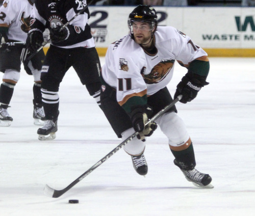 Rick Egan  | The Salt Lake Tribune 

John Armstrong (11) brings the puck down the ice for the Grizzlies, in ECHL action Grizzlies vs. The Las Vegas Wrangles, at the Maverick Center,  Monday, April 2, 2012.