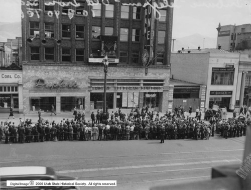 Photo courtesy Utah State Historical Society

Image shows a crowd gathered to watch the 
