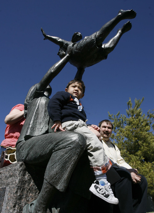 Francisco Kjolseth  |  The Salt Lake Tribune
Patrick Hoopes, 3, of Taylorsville explores all the statues surrounding the Celebration of Life Monument at library square after he ceremoniously started started the fountain. The monument is dedicated to those who have given the gift of life through organ, eye, tissue and blood donation. Patrick has been on the donor list for a small intestine for three years. Patrick who was essentially born without intestines has been on the donor list for three years in hopes of getting a small intestine.