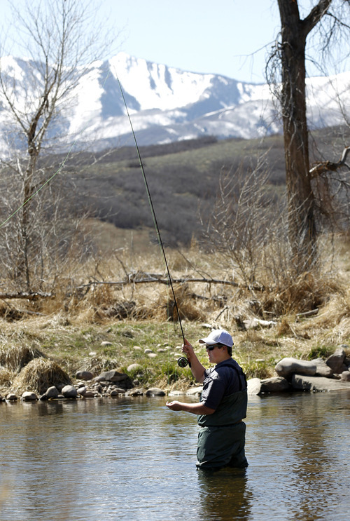 Al Hartmann  |  The Salt Lake Tribune
Parker Thorkelson of Draper fishes the Provo River west of Heber City on Wednesday, April 4. Outdoor recreation is a big draw to growth in the Heber Valley. Heber City is the nation's seventh fastest-growing micropolitan area, according to the latest Census Bureau estimates.