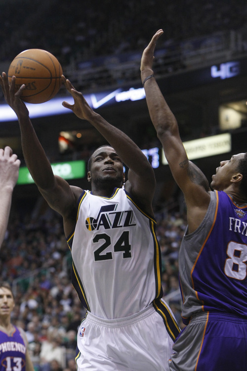 Chris Detrick  |  The Salt Lake Tribune
Utah Jazz power forward Paul Millsap (24) is guarded by Phoenix Suns center Channing Frye (8) during the second quarter of the game at EnergySolutions Arena Wednesday April 4, 2012. At half time, Phoenix is winning the game 58-56.