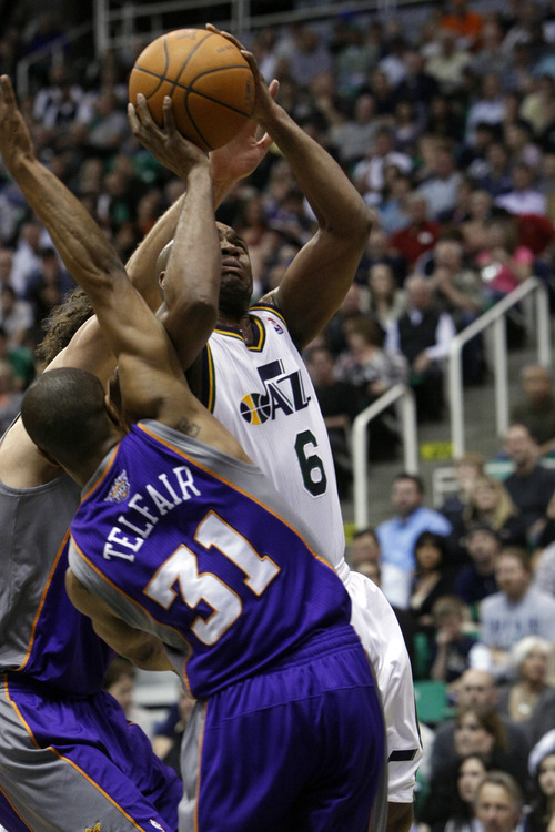 Chris Detrick  |  The Salt Lake Tribune
Utah Jazz point guard Jamaal Tinsley (6) is guarded by Phoenix Suns center Robin Lopez (15) and Phoenix Suns point guard Sebastian Telfair (31) during the second quarter of the game at EnergySolutions Arena Wednesday April 4, 2012. At half time, Phoenix is winning the game 58-56.
