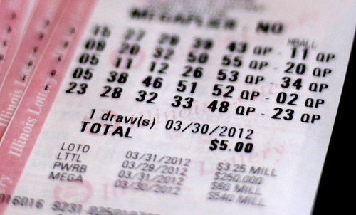A Mega Millions lottery ticket purchased in Chicago, Thursday, March 29, 2012, shows the drawing date of Friday, March 30, 2012. With the Mega Millions jackpot over $500 million, Illinois picked the right week to become the first state in the nation to sell lottery tickets online, and other states are watching closely to see how it plays out. They're also wondering if the payoff will prompt Illinois to take the next big step: launching online poker, blackjack and other casino games.(AP Photo/Charles Rex Arbogast)