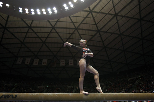 Chris Detrick  |  The Salt Lake Tribune
Stephanie McAllister competes on the beam during the gymnastics meet against Utah State at the Huntsman Center Friday January 13, 2012.