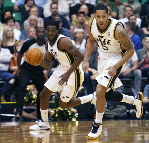 Steve Griffin/The Salt Lake Tribune


Utah's Demarre Carroll, left, and Devin Harris head up court as the run the fast break during first half action in the Jazz versus Spurs game at EnergySolutions Arena in Salt Lake City Monday April 9, 2012.