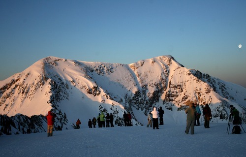 Kim Raff  |  The Salt Lake Tribune
People watch the sunrise during an Easter service on top of Hidden Peak at Snowbird Ski Resort on Sunday, April 8, 2012.