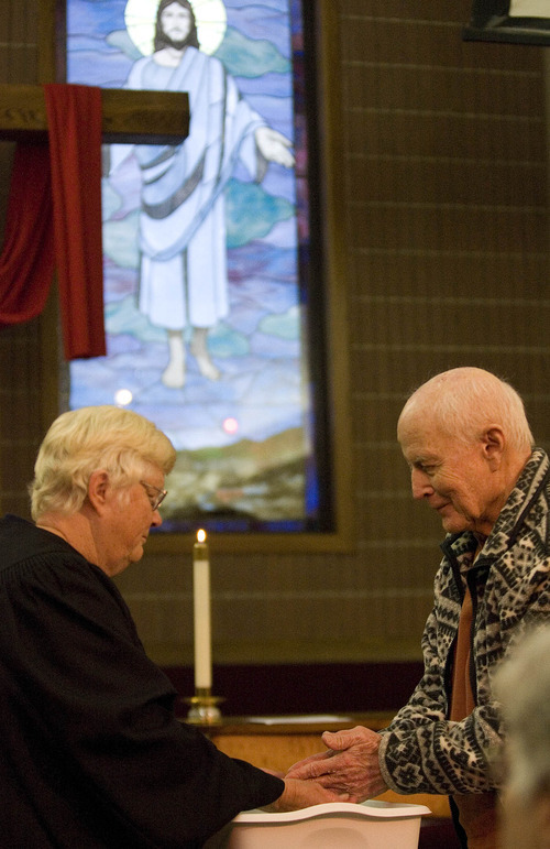 Paul Fraughton | The Salt Lake Tribune
Dayle Young and James Leach participate in the Maundy Thursday  service at Our Saviour's Lutheran Church on April 5, 2012.