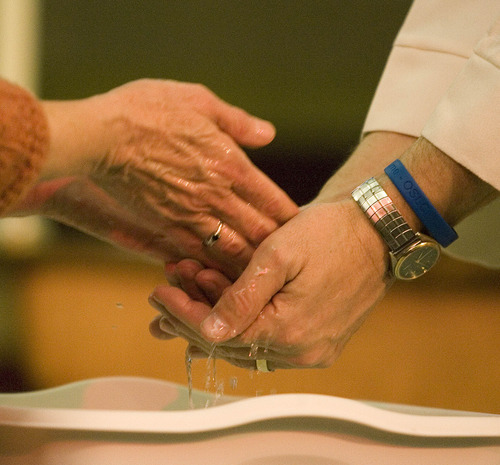 Paul Fraughton | The Salt Lake Tribune
Parishoners wash their hands during a Maundy Thursday observance at Our Saviour's Lutheran Church on April 5, 2012.