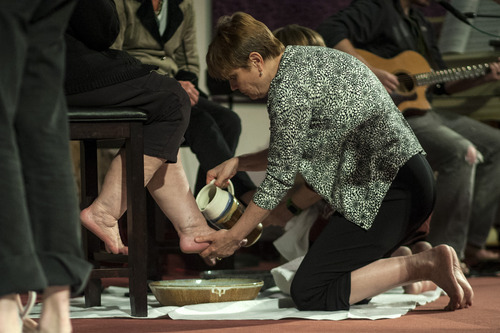Chris Detrick  |  The Salt Lake Tribune
Karen Jackson washes a fellow member's feet during a Maundy Thursday service at Mount Olympus Presbyterian Church on April 5, 2012.
