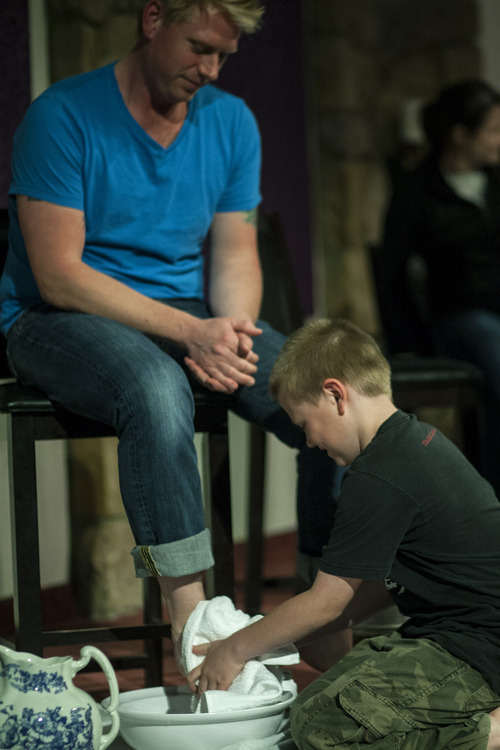 Chris Detrick  |  The Salt Lake Tribune
Chase White, 8, washes the feet of his dad, Dave White, during a Maundy Thursday service at Mount Olympus Presbyterian Church on April 5, 2012.