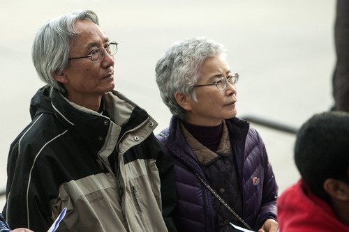 Chris Detrick  |  The Salt Lake Tribune
First United Methodist Church Pastor Eun-sang Lee and his wife, Yvonne Lee, pastor at Centenary United Methodist Church, participate in the Good Friday Procession of the Cross Friday, April 6, 2012.