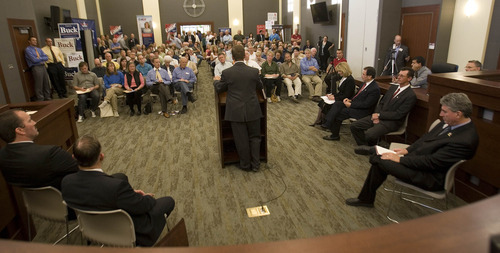 Paul Fraughton | The Salt Lake Tribune.
A standing-room only crowd at the North Salt Lake City Council Chambers listen to a debate between candidates for the 2nd Congressional District.
 Monday, April 9, 2012
