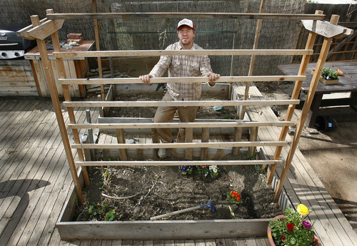 Scott Sommerdorf  |  The Salt Lake Tribune             
Salt Lake City resident Chris Gleason poses on March 25, 2012, next to the tomato trellis he built at his Salt Lake City home.  Gleason's the author of several how-to books, including 