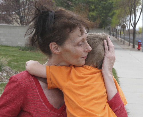 Lennie Mahler  |  The Salt Lake Tribune
Sylvia Hartvigsen comforts her grandson Aiden, 3, at the home of Laraine Reid in West Jordan, Tuesday, April 10, 2012. Shantelle Reid, Aiden's mother, was shot and killed Monday, allegedly by 31-year-old Ryan Robinson in Murray.
