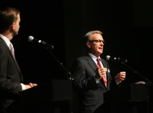 Kim Raff | The Salt Lake Tribune
(left) Pete Ashdown listens as Scott Howell answers a question during the Democratic debate for U.S. Senate at Juan Diego Catholic High School auditorium in Draper, Utah on April 11, 2012.