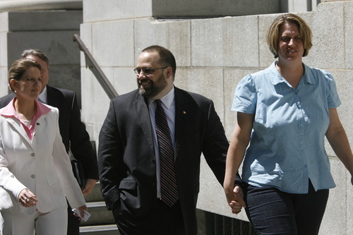 Rick Egan  |  Tribune file photo
Rick Koerber and wife Michelle hold hands in 2009 as they leave the Federal Courthouse in Salt Lake City. Koerber divorced his wife that year and married Jewel Skousen, left, an employee of Koerber's Free Capitalist Project.