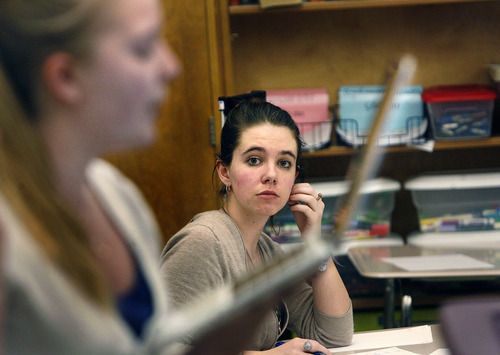 Scott Sommerdorf  |  The Salt Lake Tribune             
Hannah Shoell (center) listens as her Olympus High team mate Annie Olsen reads from her laptop as they compete in the 4A state debate championships. Students compete in the Policy debate and Lincoln-Douglas style debates, Saturday, March 10, 2012.