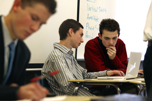Scott Sommerdorf  |  The Salt Lake Tribune             
Branden Washington (far right), confers with his East High team mate Brennan Oglesby as they compete in the 4A state debate championships. Students compete in the Policy debate and Lincoln-Douglas style debates, Saturday, March 10, 2012. At far left is Tyler DeBruin of Westlake.
