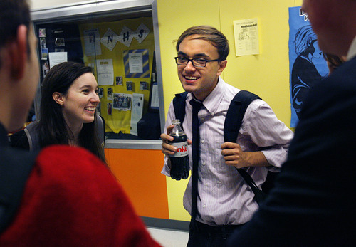 Scott Sommerdorf  |  The Salt Lake Tribune             
Andre Washington (center) and his team mate Jessica Oglesby of East High talk with other East High debaters as they wait for their next pairing, or 