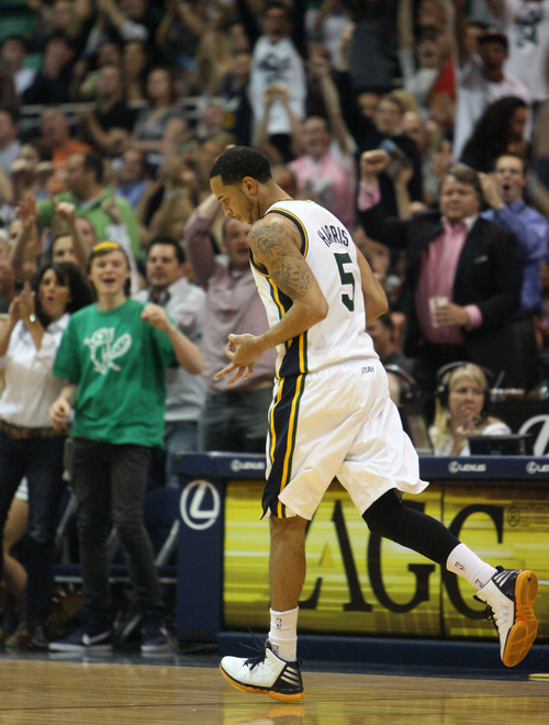 Steve Griffin/The Salt Lake Tribune


Utah's Devin Harris holds out three fingers after nailing a three pointer against the San Antonio Spurs at EnergySolutions Arena in Salt Lake City Monday April 9, 2012. Harris had a huge fourth courter leading the Jazz to victory.