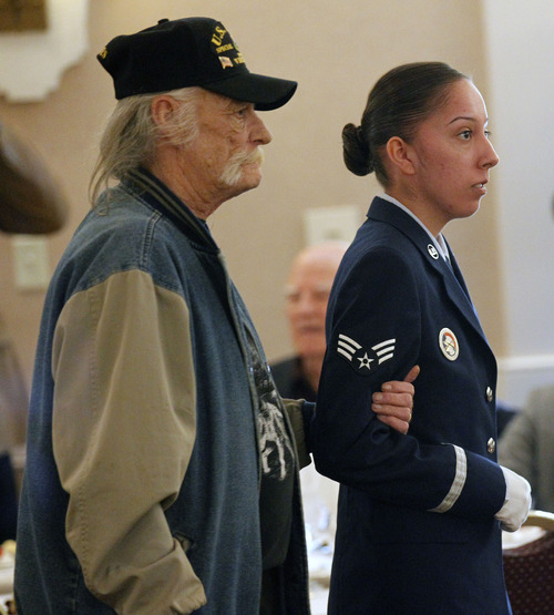 Al Hartmann  |  The Salt Lake Tribune
Vietnam POW Dave Groves is escorted by Hill Air Force base honor guard for recognition during a Prisoner of War appreciation luncheon Friday, April 13.