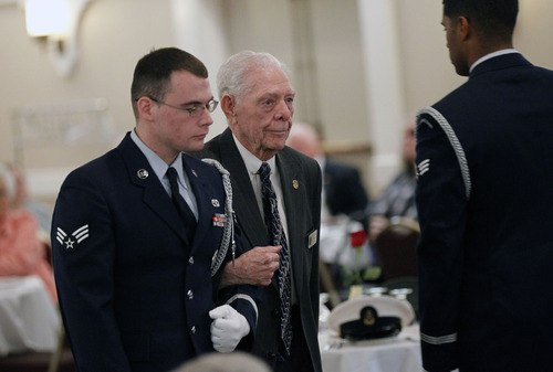 Al Hartmann  |  The Salt Lake Tribune
World War II Marine Ray Church of Delta is escorted by Hill Air Force base honor guard for recognition during a Prisoner of War appreciation luncheon Friday, April 13.