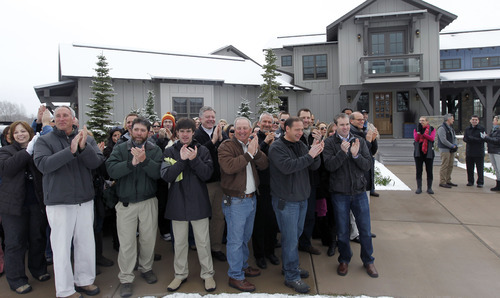 Al Hartmann  |  The Salt Lake Tribune
Crowd and members of HGTV staff applalud as Vicki and William Naggy of Acme, PA, get a first look at their new $2 million dollar grand prize HGTV Dream Home in Midway on Friday, April 13.