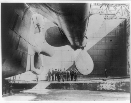 Library of Congress photo

Workers stand below one of the Titanic's giant propellers before the ship was launched.