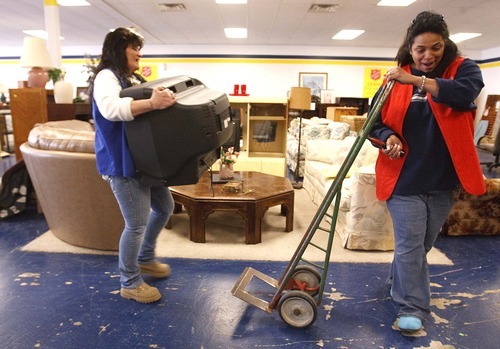 Leah Hogsten  |  The Salt Lake Tribune
Murray Salvation Army store employees Beth Hanson (left) and Betty Garcia (right) move merchandise Friday, April 13, 2012 . Because of increasing operating costs and shrinking profits, The Salvation Army is closing its two thrift stores in Salt Lake County. The West Valley City store closed last month and the Murray store's last day of business will be June 29.