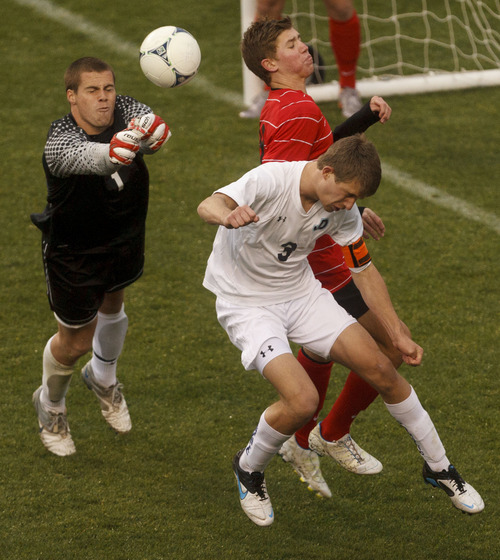 Trent Nelson  |  The Salt Lake Tribune
Alta goalkeeper AJ Snell knocks the ball away from Juan Diego's Adam Richardson (3). Alta vs. Juan Diego, competing in the Real Cup High School Soccer Tournament at Rio Tinto Stadium Saturday, April 14, 2012 in Salt Lake City, Utah. Alta's