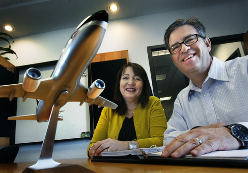 Scott Sommerdorf  |  The Salt Lake Tribune             
Mike Cameron and his wife, Camille, in Mike's office at Christopherson Business Travel Monday, April 9, 2012. They have built their company's volume from $1 million to $287 million in 22 years. They've expanded with offices in Denver and San Francisco.