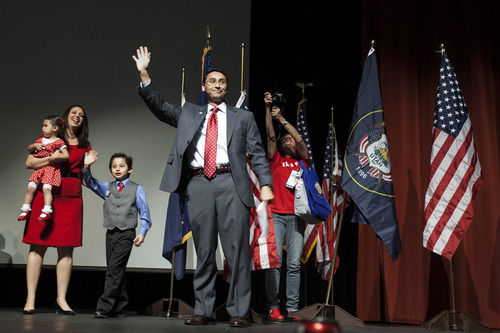 Chris Detrick  |  The Salt Lake Tribune
Salt Lake County mayor candidate Ross Romero and his family wave to their supporters during the Salt Lake County Democratic Party Nominating Convention at Murray High School Saturday April 14, 2012.