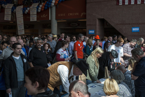 Chris Detrick  |  The Salt Lake Tribune
Delegates wait in line to cast their ballots for Salt Lake County mayor during the Salt Lake County Democratic Party Nominating Convention at Murray High School Saturday April 14, 2012.