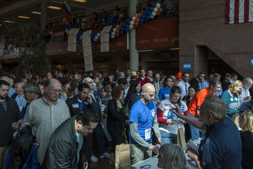 Chris Detrick  |  The Salt Lake Tribune
Delegates wait in line to cast their ballots for Salt Lake County mayor during the Salt Lake County Nominating Convention at Murray High School Saturday April 14, 2012.