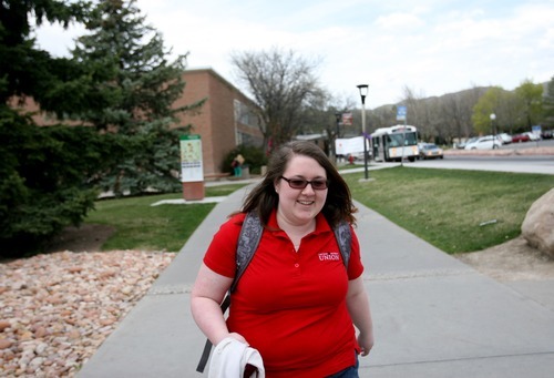 Kim Raff | The Salt Lake Tribune
University of Utah senior Valerie Johnson walks to a Writing for Strategic Communications class on the U. campus in Salt Lake City, still in the shirt she wears for her job at the student union building. Administrators encourage students who work to find jobs on campus, because such students graduate faster than those working off-campus. Utah students graduate with less debt than in almost any other state.