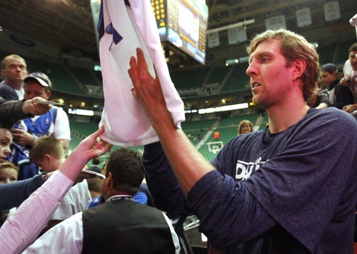Rick Egan  | The Salt Lake Tribune 

Dallas Maverick's Dirk Nowitzki signs autographs before the game agains the Dallas Mavericks, at he EnergySolutions Arena, Monday, April 16, 2012.