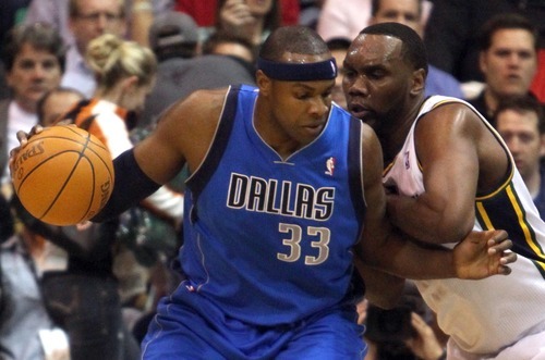 Rick Egan  | The Salt Lake Tribune 

Dallas Mavericks center Brendan Haywood (33) works the ball inside, as Utah Jazz center Al Jefferson (25) defends, in NBA action,  the Dallas Mavericks vs. The Utah Jazz, at  EnergySolutions Arena, Monday, April 16, 2012.
