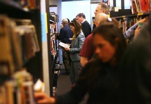 Kim Raff  |  The Salt Lake Tribune
People crowd the aisles of the Friends of the City Library Used Book Sale at the Salt Lake City Library on Sunday, April 15, 2012. The sale continues through Tuesday.