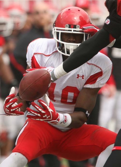 Leah Hogsten  |  The Salt Lake Tribune
Utes receiver DeVonte Christopher makes the catch and finally slips past defensive back Keith McGill. University of Utah football team held their Spring red and white scrimmage Saturday, April 14 2012 in Salt Lake City at Rice Eccles Stadium.