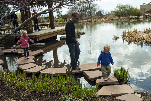 Chris Detrick  |  The Salt Lake Tribune
Jeff Porucznik and his kids Quinn, 2, and Zoey, 5, help measure walking distances with Lindsay Janicki at Red Butte Garden Friday April 13, 2012. Track-It SLC aims to increase the amount of physical activity children engage in by providing caregivers with diverse walking routes and associated distances for recreational attractions throughout Salt Lake.