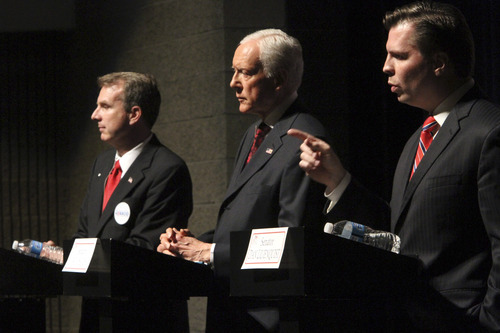 FILE - In this April 4, 2012, file photo, Sen. Orrin Hatch, center, faces off with Republican candidates for U.S. Senate Chris Herrod, left, and and Dan Liljenquist, during a debate sponsored by the Utah League of Women Voters at Juan Diego High School in Salt Lake City. (AP Photo/The Salt Lake Tribune, Rick Egan, File)  DESERET NEWS OUT; LOCAL TV OUT; MAGS OUT