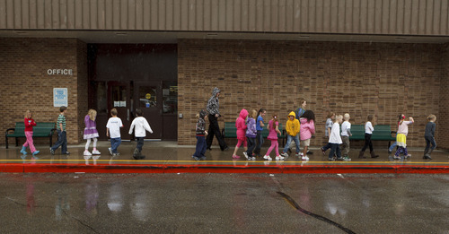 Trent Nelson  |  The Salt Lake Tribune
First graders at Granite Elementary evacuate the school during a statewide earthquake drill Tuesday, April 17, 2012 in Sandy, Utah.