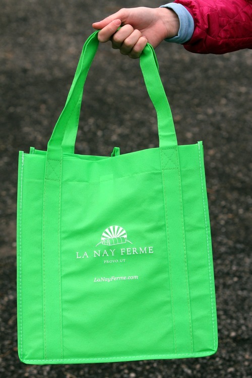 Rick Egan  | The Salt Lake Tribune 

A re-usable shopping bag from the La Nay Ferme farm in Provo, which is Utah's newest CSA - community supported agriculture program. Sign-ups are under way for about 40 CSA programs in Utah.
