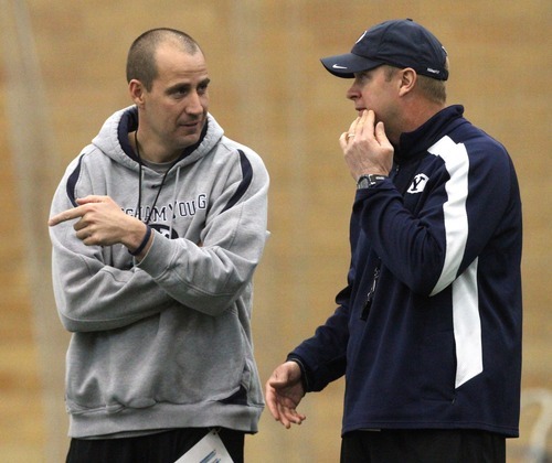 Rick Egan  | The Salt Lake Tribune 

BYU head coach Bronco Mendenhall chats with offensive coordinator, Brandon Doman, during spring practice, Monday, March 26, 2012.