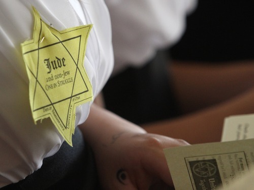 Rick Egan  | The Salt Lake Tribune 

Participants wore yellow stars as Utah's Jewish community paid tribute to the millions who lost their lives during the Holocaust. The event was at the Jewish Community Center, Thursday, April 19, 2012.