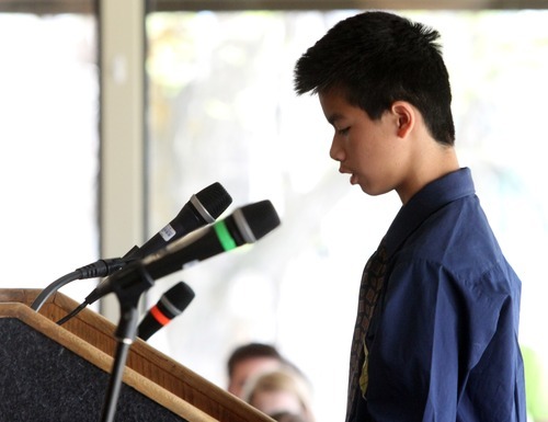 Rick Egan  | The Salt Lake Tribune 

Gabriel Cheng, an eighth grader from the McGillis School, reads his wining poem, 