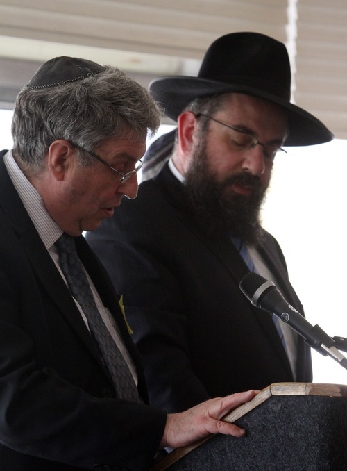 Rick Egan  | The Salt Lake Tribune 

Rabbi Fred Wenger, left, and Rabbi Benny Zippel read the Kaddish,  as Utah's Jewish community paid tribute to the millions who lost their lives during the Holocaust. The event was at the Jewish Community Center, Thursday, April 19, 2012.