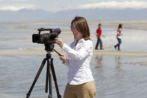 Al Hartmann  |  The Salt Lake Tribune
Shirley Erickson Gorospe has made a documentary about a state plan to lease thousands of acres of the Great Salt Lake to a mineral company that plans to build a series of dikes to help harvest minerals. Gorospe wants to stop the project and spent her own money to make the documentary she released on YouTube.  She films as her children Archie and Emily play near Saltair on Monday April 16.