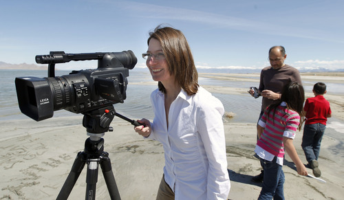 AAl Hartmann  |  The Salt Lake Tribune
Shirley Erickson Gorospe has made a documentary about a state plan to lease thousands of acres of the Great Salt Lake to a mineral company that plans to build a series of dikes to help harvest minerals. Gorospe wants to stop the project and spent her own money to make the documentary she released on YouTube.  She films as her husband Archie and children Eric and Emily play near Salt Air on Monday April 16.